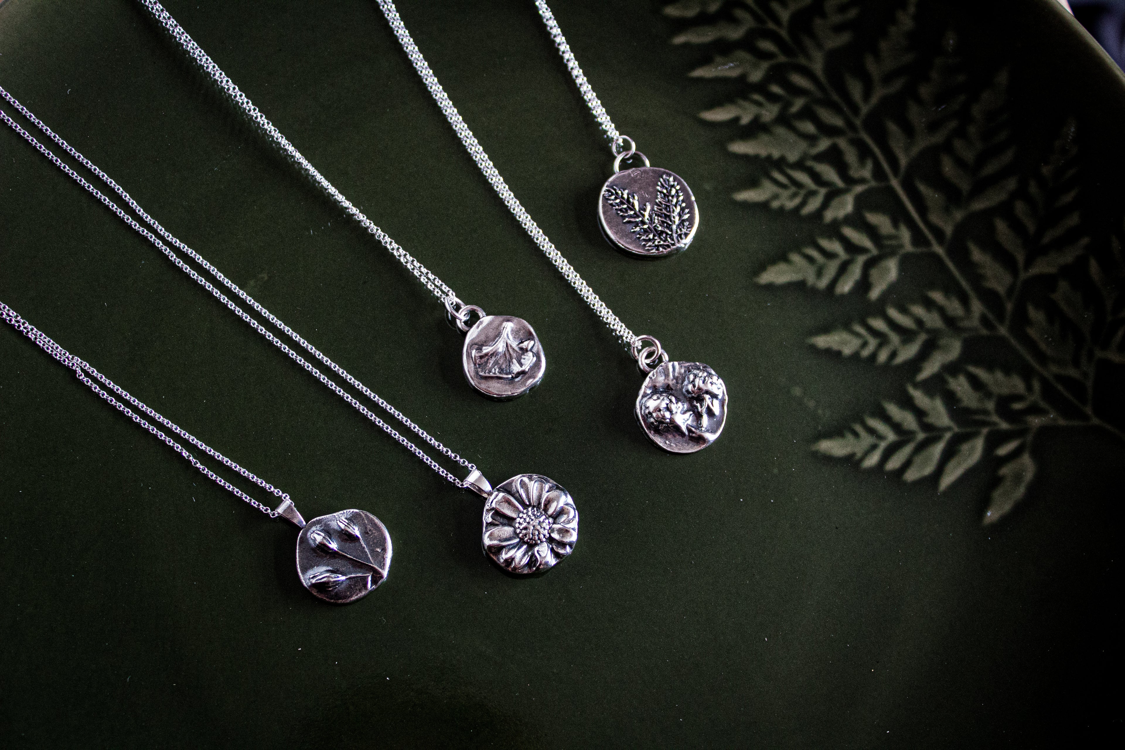 Fine silver charms with botanical impressions