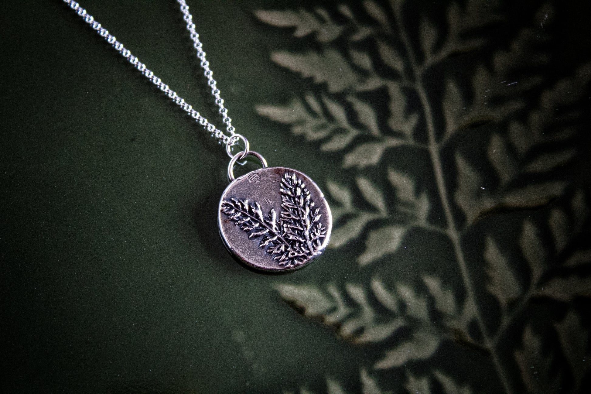 Botanical impression silver fern charm